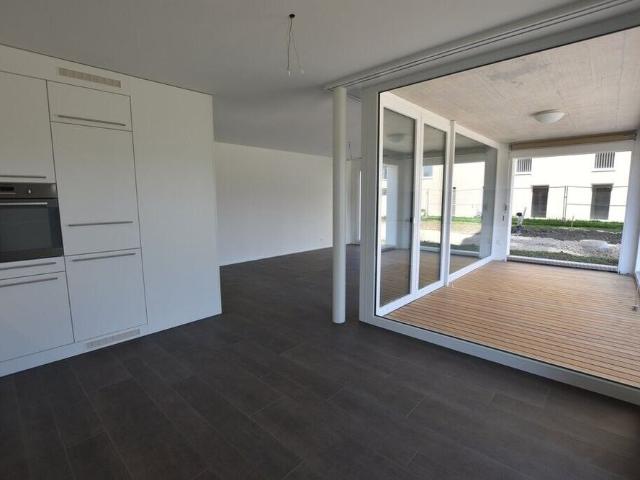 Modern ground floor apartment with garden seating area