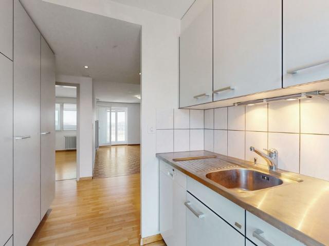 Modern Minergie apartment with glazed balcony, open kitchen & Reduit