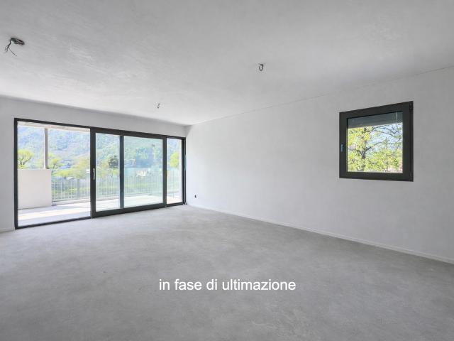 Modern und neues 3,5 Zimmer Doppelhaus mit Garten in Melano