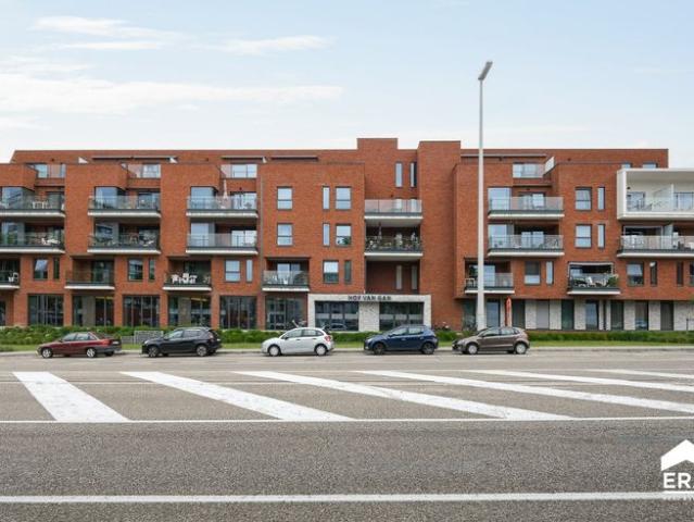 Moderne serviceflat met 1 slpk en dubbel terras te Genk