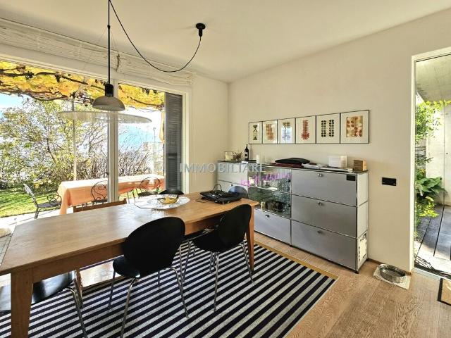 Modern house in sunny, quiet location, with fireplace and small garden | dreamo. Ch