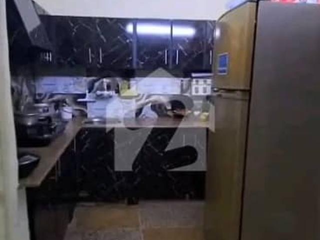North Nazimabad block k Flat available for sale 1st floor 2 bed DD Corner old building