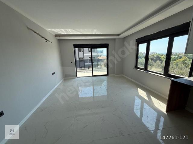 OKURCALARDA SATILIK LÜKS DAİRE 1.KAT 1+1 57M2 İSKANLI DENİZE 500 METRE MESAFEDE