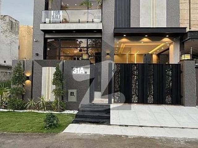 On Wide 50 Feet Road 5 Marla Brand New Luxury Ultra Modern Design Most Beautiful Bungalow For Sale At Prime Location Of DHA Lahore Near To Park Masjid & Commercial Market