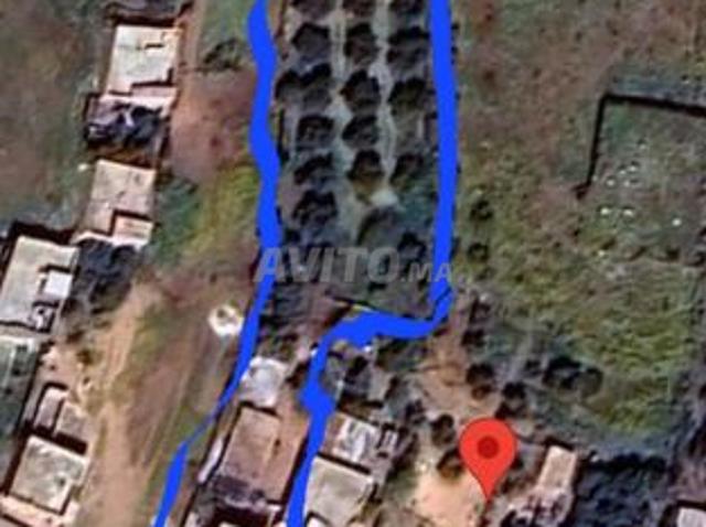 Opportunité: Maison à deux étages avec garage à Oued Beht