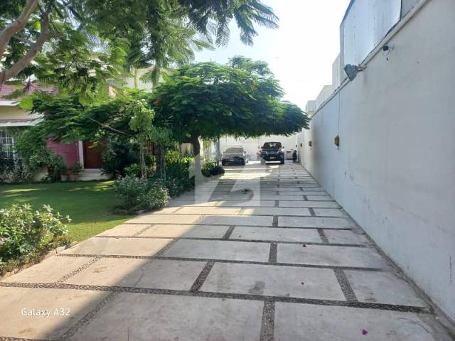 Opportunities To Own An Estate Of This Magnitude In The Heart Of DHA Phase 1 Are Exceptionally Rare. Spanning A Massive 2200 Square Yards, This Grand, Beautifully Designed, And Meticulously Maintained Bungalow