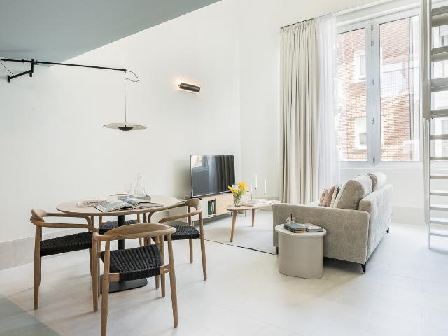 Outward facing one bedroom duplex in a brand new building