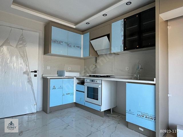 ÖZBEY EMLAKTAN KOYUNDEREDE KAPALI MUTFAK SIFIR SATILIK 2+1 DAİRE