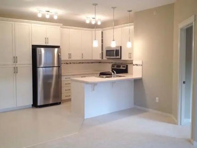 Panorama Hills Bright Top Floor 2 bedroom Condo with 2 PARKING STALLS