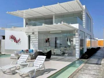 PARACAS. MODERNA CASA EN VENTA AMOBLADA Y EQUIPADA CON LANCHA INCLUIDA