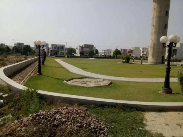 Park facing 5 marla plot in model city 1 canal road Faisalabad ID 66869