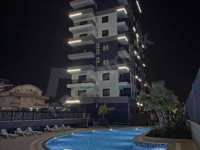 PAYALLAR'DA FULL AKTİVİTELİ SATILIK KAT MÜLKİYETLİ 1+1
