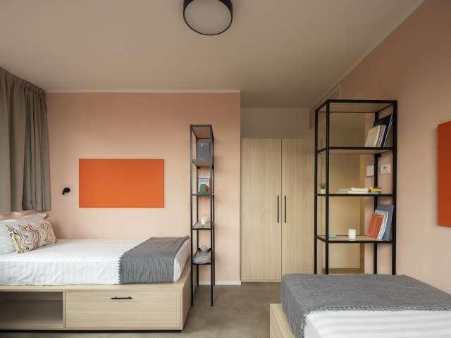 Posto letto in camera condivisa in residence con palestra e coworking inclusi