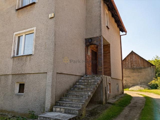 Przestronny dom z potencjałem inwestycyjnym i ogrodem 1200 m²