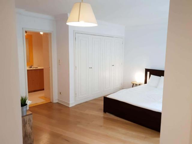 Quarto com cama de casal, com casa de banho privada, em apartamento com 6 quartos FLAT LUPI LUPI 6