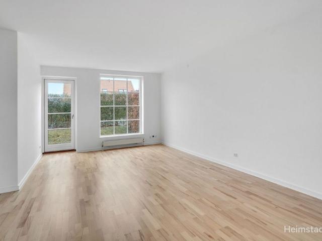 Rækkehus med skøn gårdhave et stenkast fra vandet