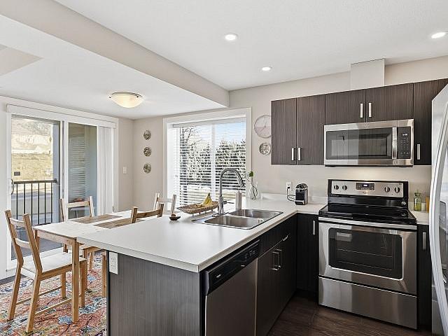 Rare 2 Level Corner Unit Condo For Sale!