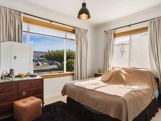 Renovated Alexandra character home with four bedrooms, garage, fenced yard, and parking