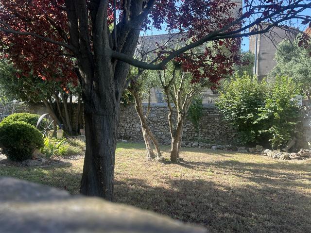 Rez de jardin avec grand garage