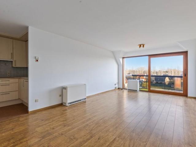 Ruim appartement met drie slaapkamers en parking te koop!