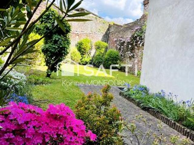 Maison avec petit jardin et cave