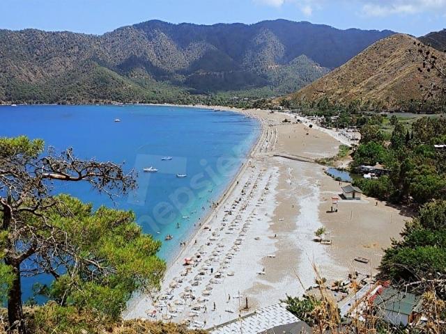 SAKLI CENNET ANTALYA ADRASAN KOYU'NDA 500M2 İMARLI SATILIK ARSA