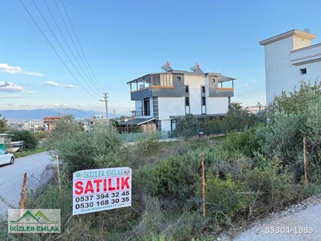 Seferihisar doğanbeyde satılık 285 metre köşe imarlı arsamız Acil satılık