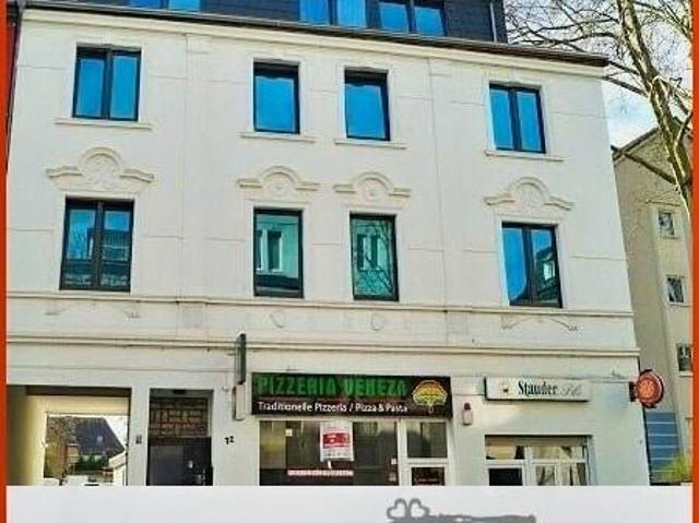 Solides Mehrfamilienhaus mit Gewerbeeinheit und 6 Garagen in attraktiver Lage