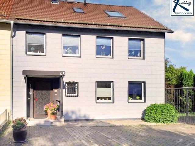 Solides Zweifamilien Reihenendhaus mit großem Garten, Doppelgarage und vielseitigen Nutzungsmöglichkeiten in Oker