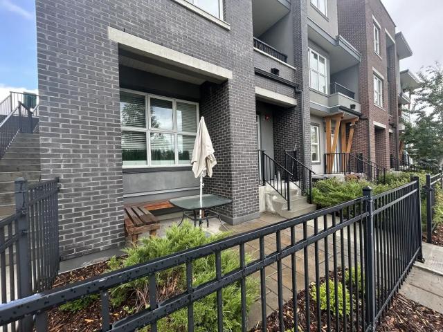 South facing private fenced patio / walking distance to Mount Royal University!