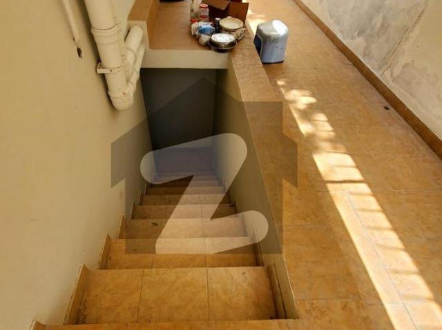 Slightly used Tiled flooring house With small basement servant quarters DHA Phase 5