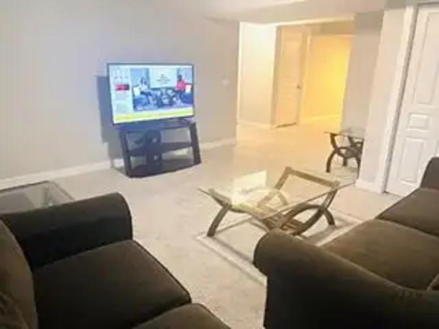 Spacious 1 Bedroom + Den Basement Apartment