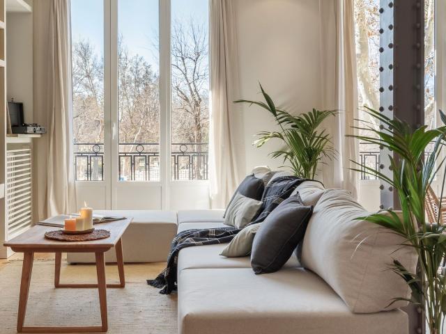 Spacious 3 Bedroom Apartment with Indonesian Inspired Design and Private Office in Ibiza Neighborhood, Madrid Amsterdam Apartments for Rent