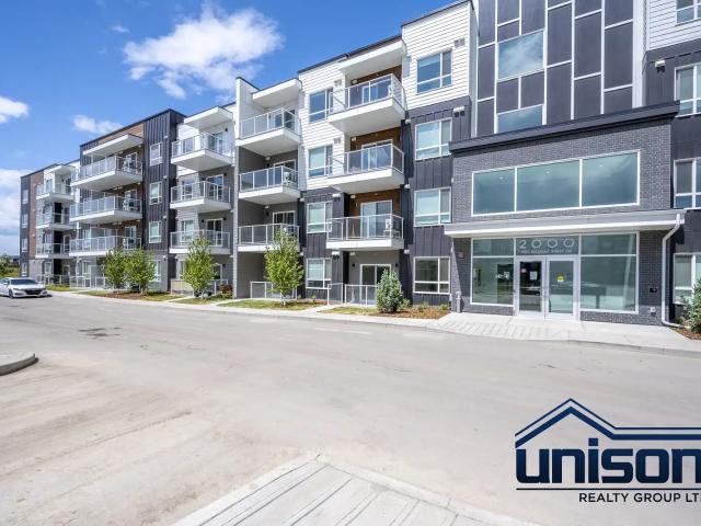 Spacious Top Floor 2 Bedroom Condo at Belmont Plaza