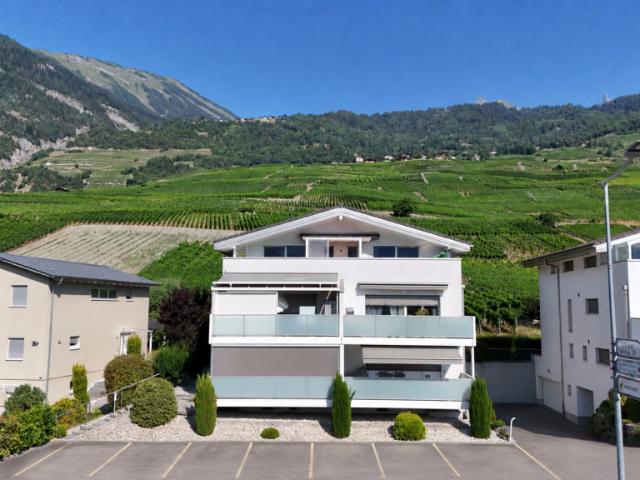 Spacieux attique de 4,5 pièces de 146 m2 bénéficiant d'une vue imprenable sur les Alpes