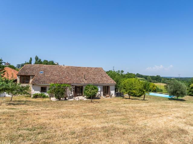 Stone property with pool on the edge of a village