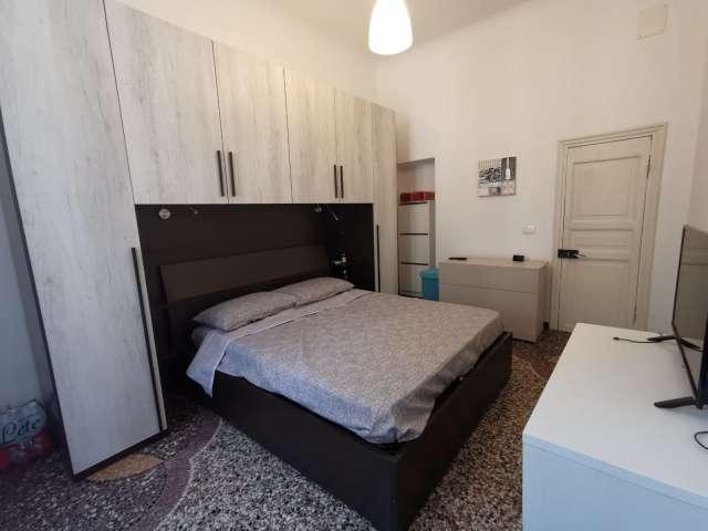 Stanze in affitto in un appartamento con 4 camere da letto a Genova