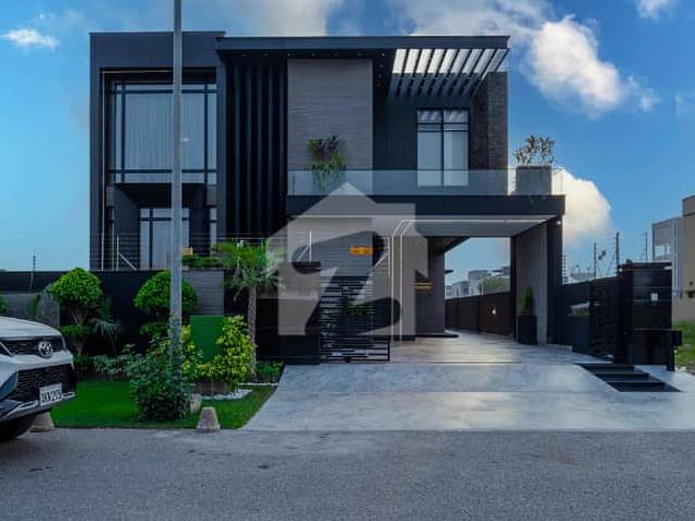 Step into Luxury 1 Kanal Slightly Used Bungalow Featuring Basement, Stylish Interiors, 4 Car Parking, and a Grand Architectural Design in the Heart of DHA Phase 8