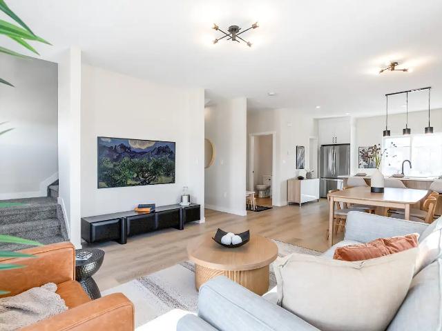 Stunning New Townhome in The Orchards Featuring a Double Attached Garage