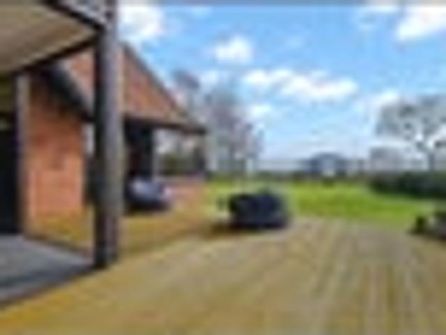 Sun soaked living with sweeping lake & rural views