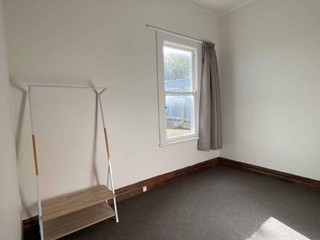 Sunny Renovated Home with no Lawns to Mow!