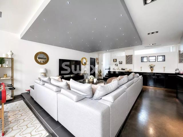 Superbe loft de 148 m² avec terrasse, jacuzzi et stationnements !