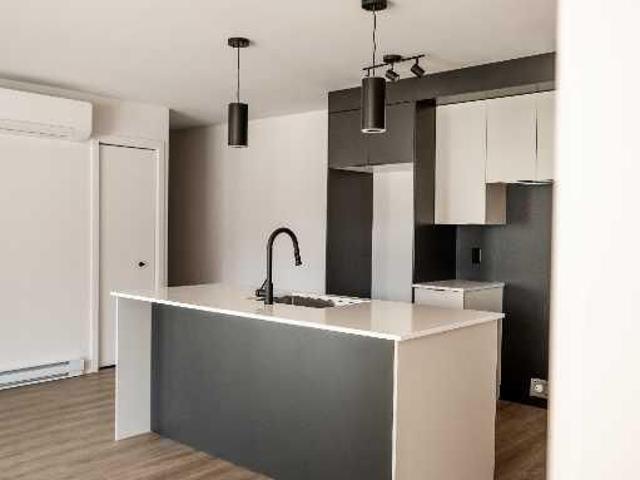 Superbe 4 1/2 dans un bâtiment neuf